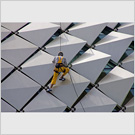 Image No : G8R3C4 : Worker on the roof of the Esplanade building